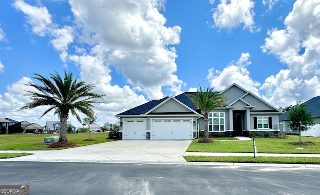 view of front of property with a garage and a front lawn