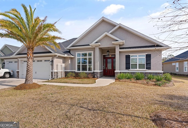 view of front of home featuring a garage and a front lawn