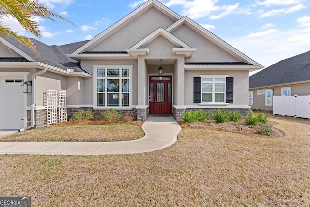 view of front facade featuring a garage and a front lawn