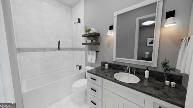 full bathroom featuring tile patterned floors, vanity, toilet, and tiled shower / bath combo