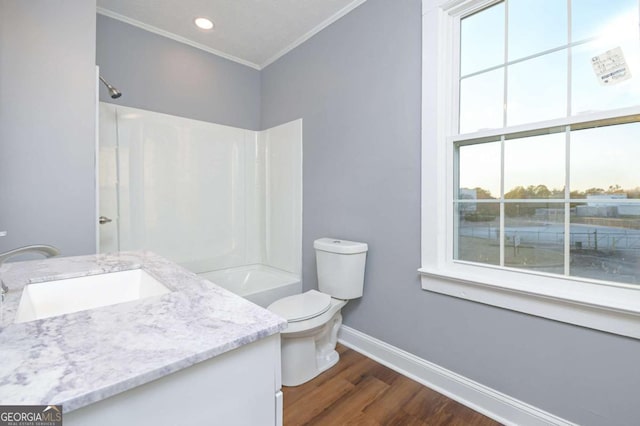 full bathroom with toilet, crown molding, shower / bathing tub combination, vanity, and hardwood / wood-style flooring