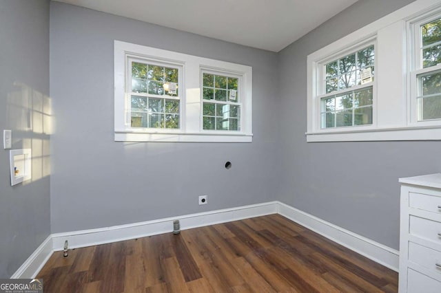 spare room with dark hardwood / wood-style floors