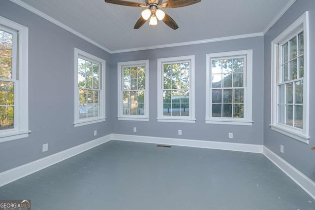 unfurnished sunroom with a wealth of natural light and ceiling fan