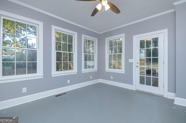 unfurnished sunroom with ceiling fan