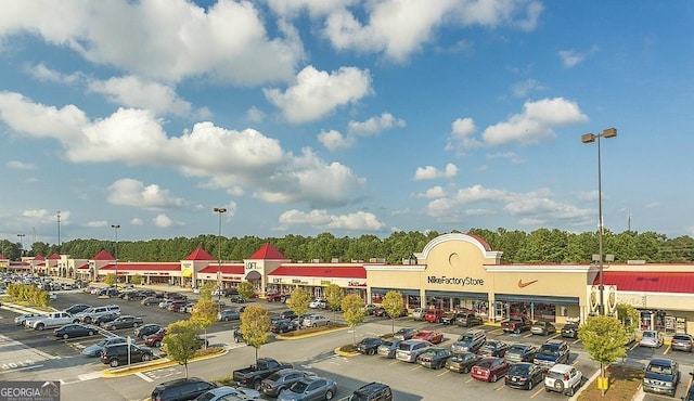 view of building exterior with uncovered parking