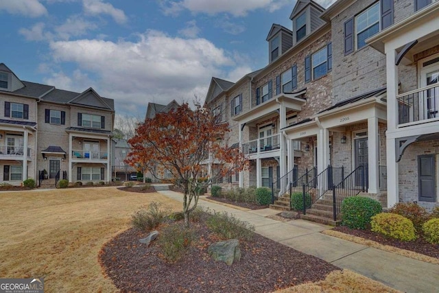 view of home's community with a lawn