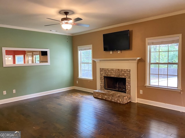 unfurnished living room with crown molding, dark hardwood / wood-style floors, and a brick fireplace