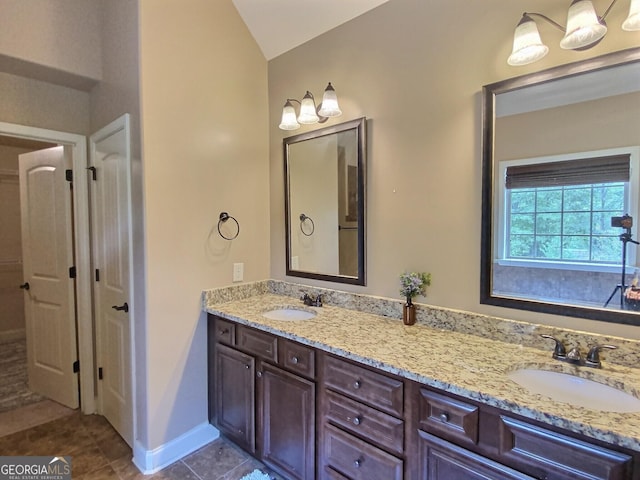 bathroom featuring tile patterned flooring and vanity