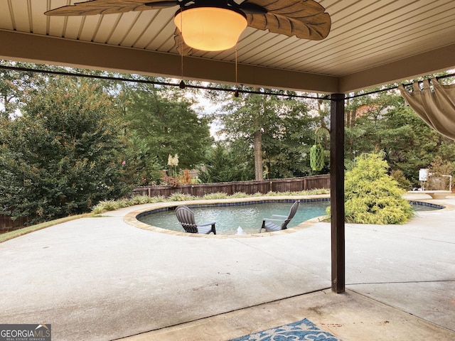 view of swimming pool with a patio