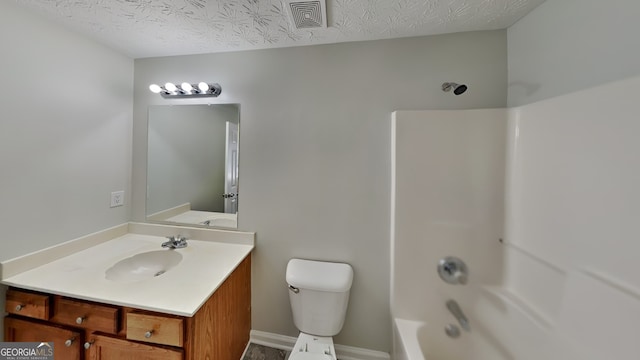 full bathroom featuring bathtub / shower combination, vanity, toilet, and a textured ceiling