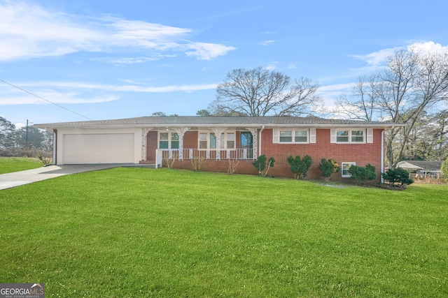 single story home with a porch, a garage, and a front yard