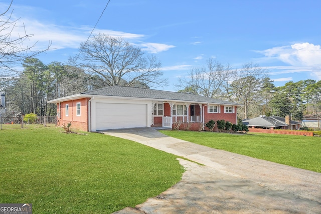 single story home featuring a garage and a front lawn