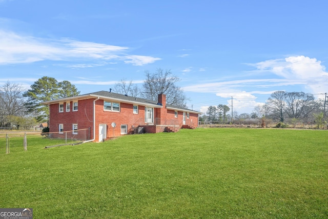 view of side of home with a lawn