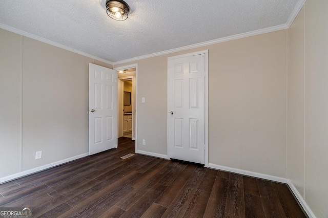 unfurnished bedroom with crown molding, dark hardwood / wood-style floors, and a textured ceiling