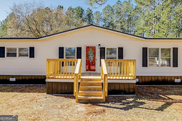 view of front of house with a wooden deck