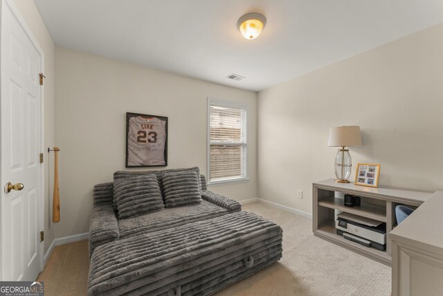 bedroom with light carpet