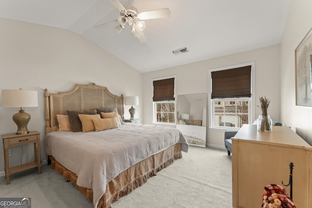 carpeted bedroom with ceiling fan and lofted ceiling