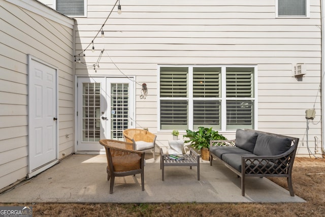 view of patio with an outdoor living space and french doors