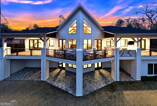 view of back house at dusk