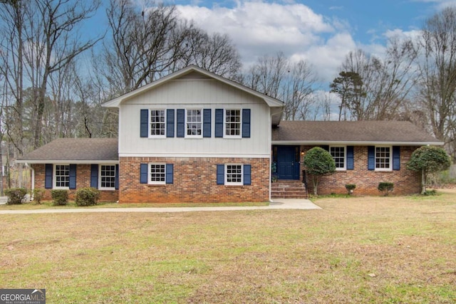 tri-level home with a front yard