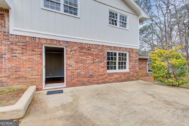 back of property with a patio