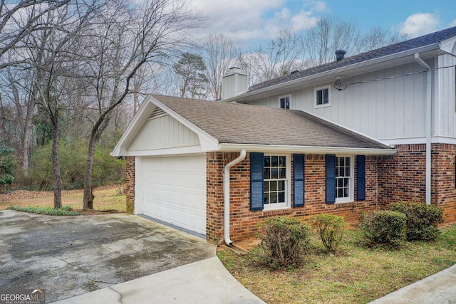 view of side of home featuring a garage