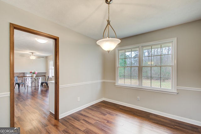 empty room with dark wood-type flooring