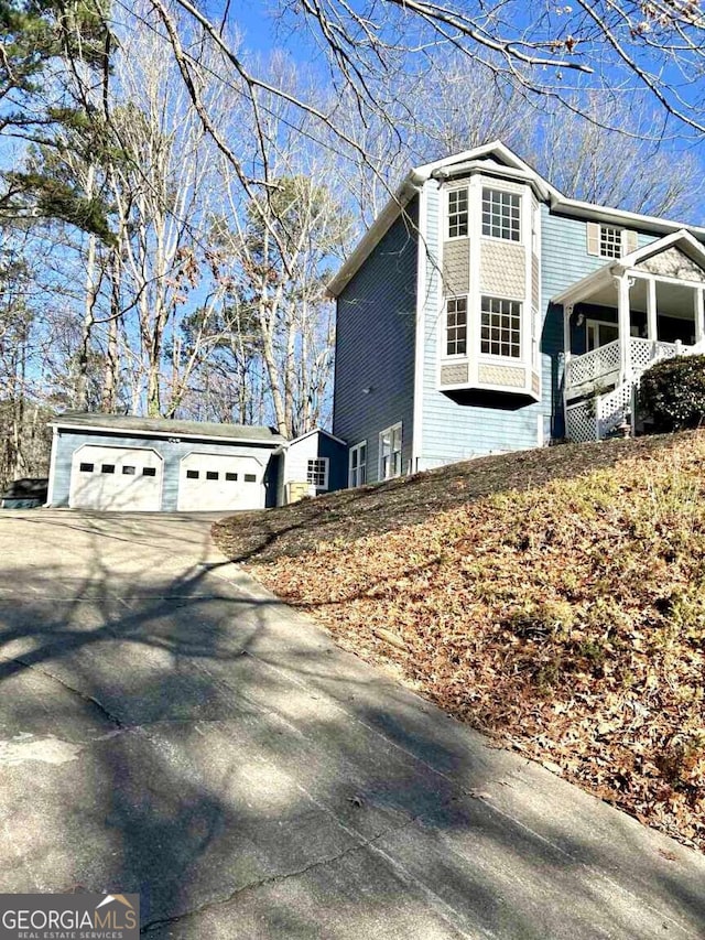 view of property exterior featuring a garage