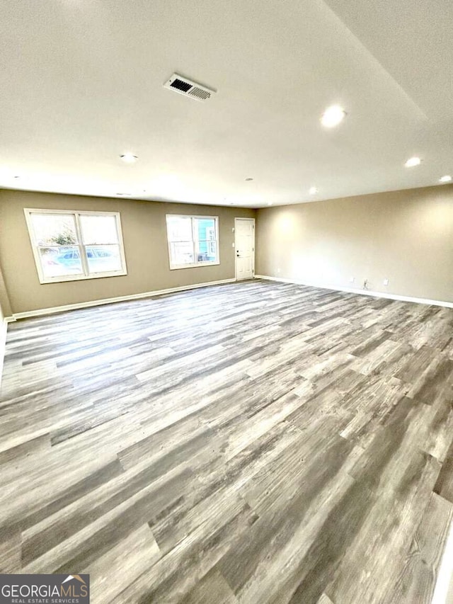 spare room with hardwood / wood-style flooring