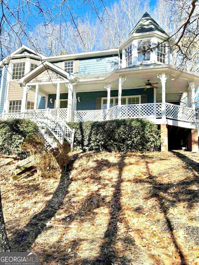 view of front of house with ceiling fan and covered porch