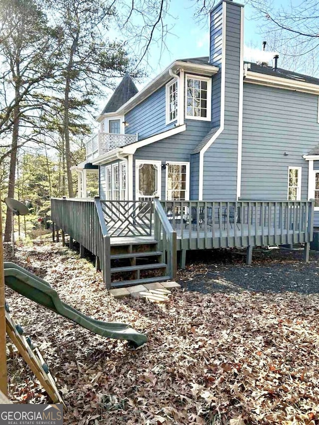 rear view of house with a deck