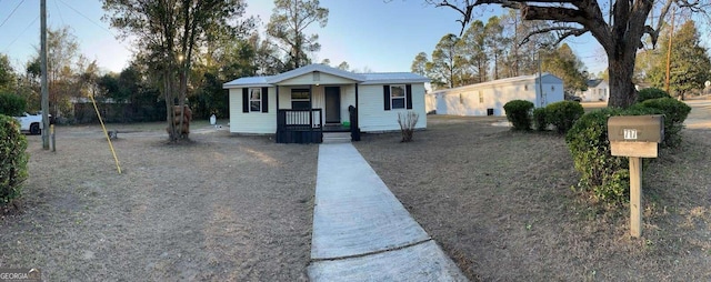 ranch-style house featuring a shed