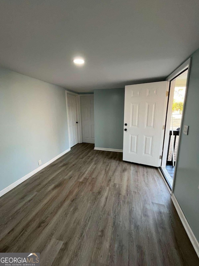 interior space with dark wood-type flooring