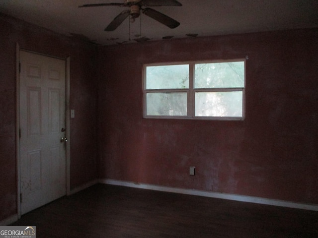 spare room featuring ceiling fan and wood-type flooring