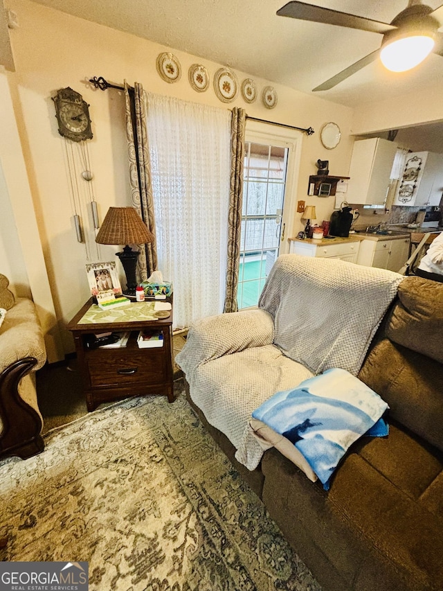 living room featuring ceiling fan