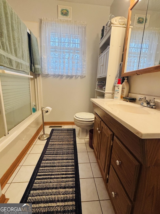 full bathroom with enclosed tub / shower combo, vanity, toilet, and tile patterned flooring