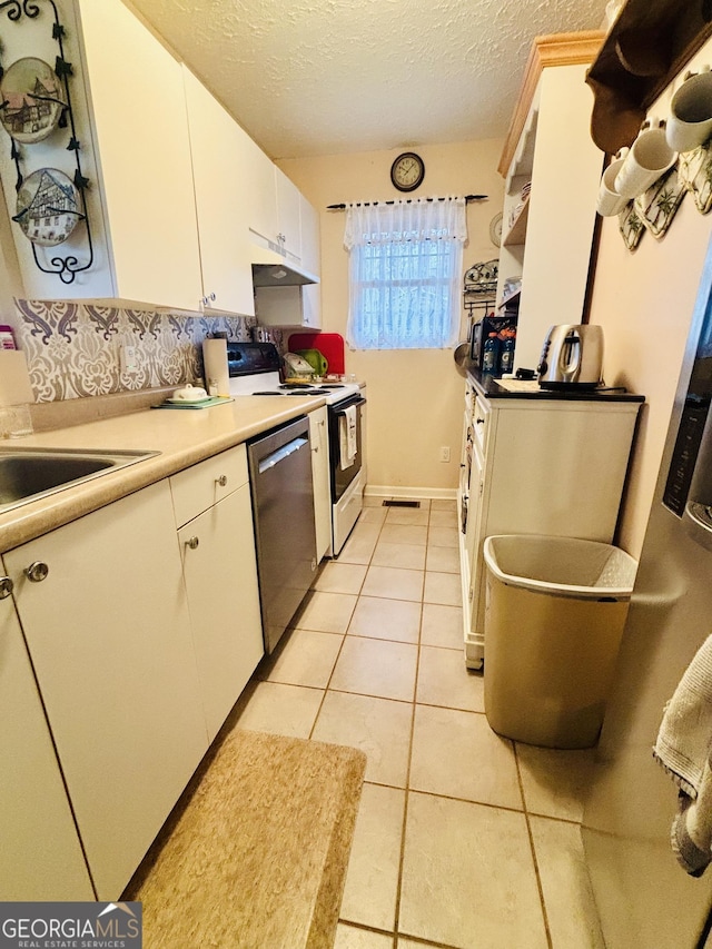 kitchen with white cabinetry, stainless steel dishwasher, light tile patterned floors, a textured ceiling, and electric stove