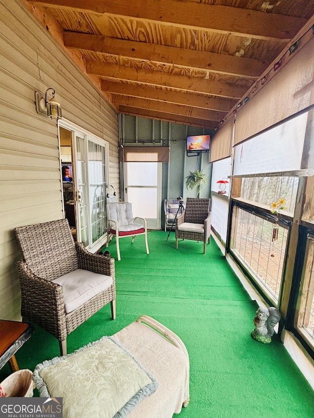 sunroom featuring wood ceiling and beam ceiling