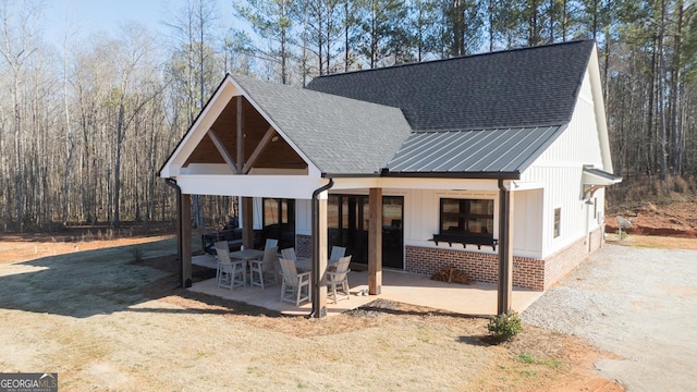 modern farmhouse with a patio