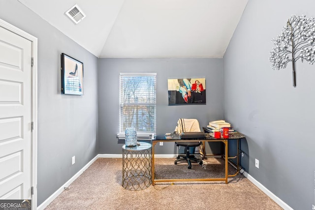 office with vaulted ceiling and carpet