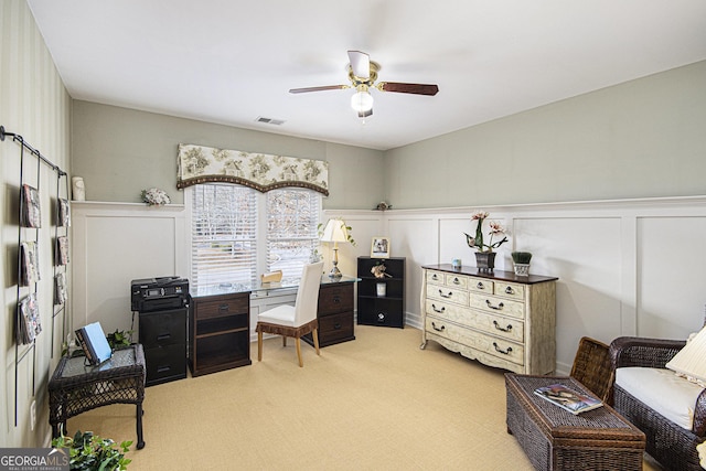 home office with ceiling fan and light colored carpet