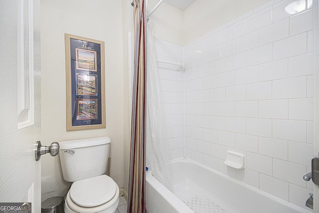 bathroom featuring toilet and shower / bath combo