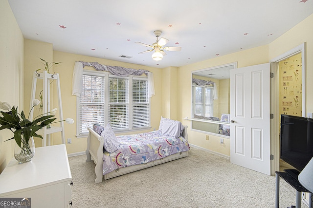 carpeted bedroom with ceiling fan