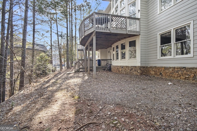 view of property exterior with a deck