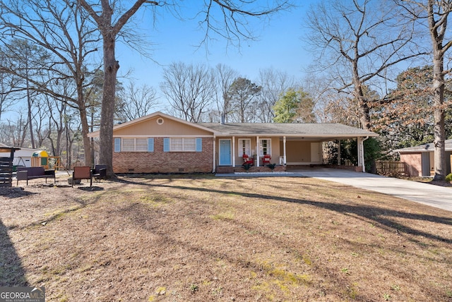 ranch-style home with a carport and a front lawn