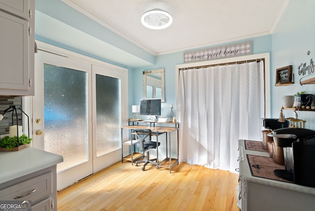 office space featuring light hardwood / wood-style flooring and ornamental molding