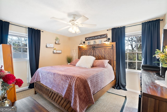 carpeted bedroom featuring ceiling fan