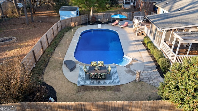 view of swimming pool with a patio area