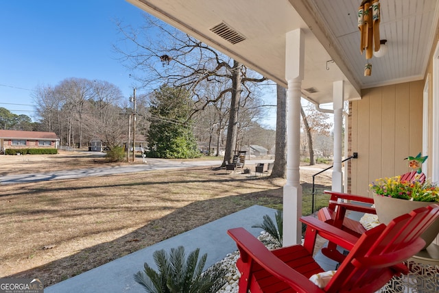 view of patio featuring a porch