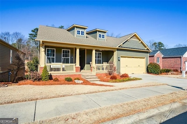 craftsman inspired home featuring a garage and covered porch